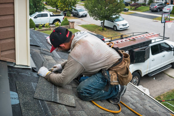 Professional Gutter Repair And Installation technician working in Mastic, NY